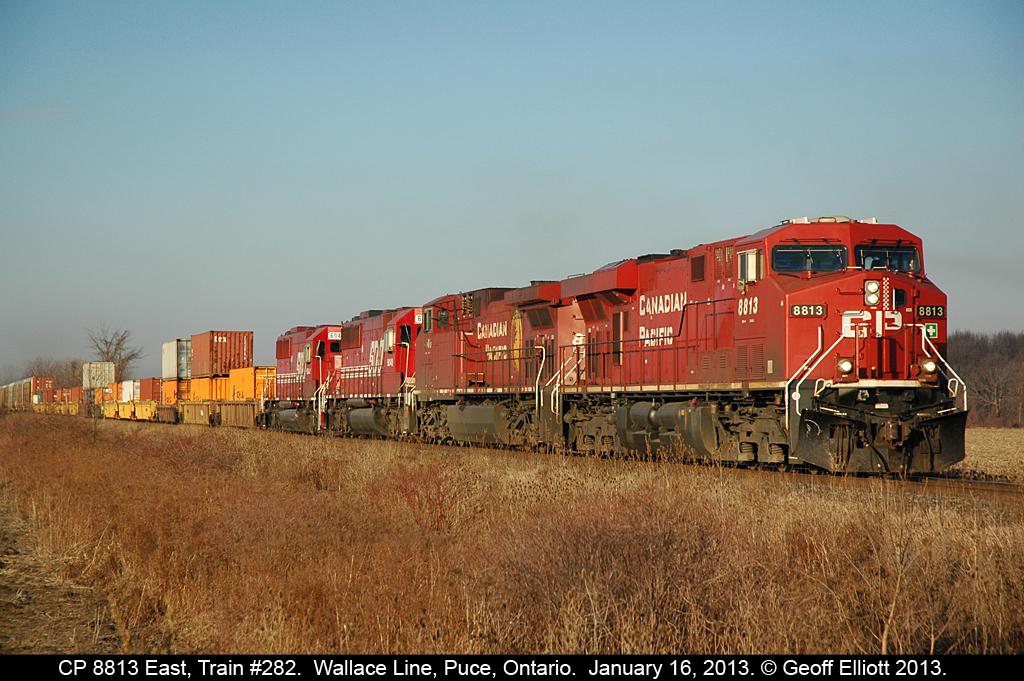 Train 282, with CP 8813, rolls through Puce, Ontario in the early morning light with 2 SOO SD60's in tow bound for rebuild at CADRail in Lachine, QC.