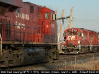 T76, with CP 7310, sits tied up at Jefferson Ave. in Windsor as 8882 gets it's train rolling east to head out of town.