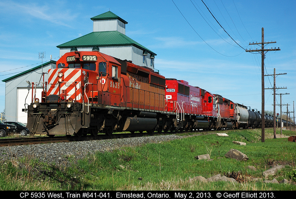 CP 5935 is wasting no time as it leads train 641-041 past the old "Rugaber's" mill in Elmstead, Ontario and on into Windsor on a beautiful May day......