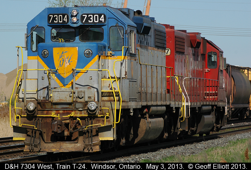 The crew of train T-24, with D&H 7304 and CP 7307 running as light power, have finished adding their EOT to the tail end of their lift at the west end of Walkerville siding.  Once tied on 7304 will lead T-24 to the U.S. to make it's connections.