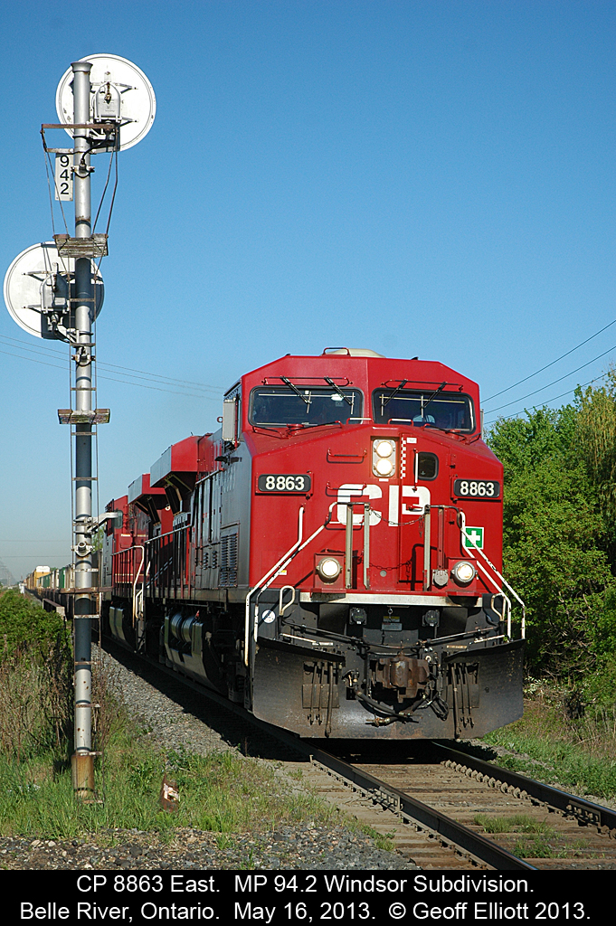 CP 8863 hustles train 240-15 east past the signal at MP 94.2 on the Windsor Subdivision.