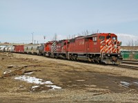 SD40-2F CP 9009, GP9u CP 1562 and SD40-2 CP 6067 wait on the CN Camrose Sub to cross back to the CP Scotford Sub with a transfer from CN's Clover Bar Yard.