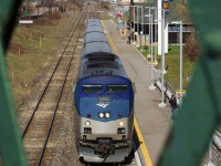 Amtrak's Toronto-Albany train # 97 'The Maple Leaf' makes its station stop at the St. Catharines VIA station, framed by the green railings of St. Paul Street. Now days this is the only passenger train to stop in St. Catharines, at least until the GO trains start again. 