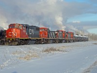 On a cold frosty New Years eve GP38-2 CN 4790 coupled with 3 GMD1's, 1400, 1434 and 1409 switch cars on the Scotford Industrial Lead at CN's Scotford Yard.