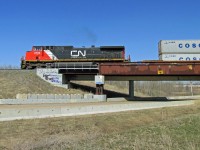 DASH 9-44CW CN 2724 crosses the new bridge on the second main line at Ardrossan.