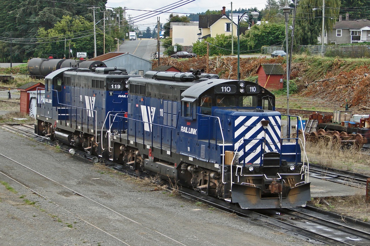 SRY GP9's 110 and 119 sit in Wellcox Yard waiting their next assignment.