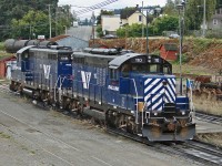 SRY GP9's 110 and 119 sit in Wellcox Yard waiting their next assignment.
