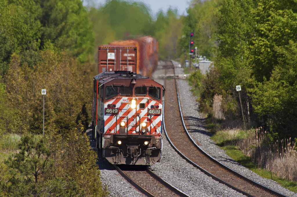 149 charges west through Newtonville with a pair of C40-8M's in charge.