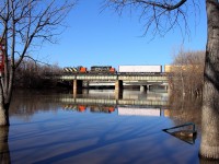 A transfer lead by a GMD1 crosses the Assiniboine River just west of Winnipeg's Union Station.