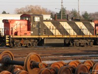 <b>Weekend Warrior.</b><br><br>Sitting amid GP9RM's of similar vintage and new wheelsets piled up nearby, CN GMD1 1422 isn't out partying this Friday evening. Rather, she's slumbering in Oakville yard as the sun sets on a busy work week, awaiting the call of duty another day.<br><br>Having long traded her lightweight branchline A-1-A Flexicoil trucks in for a set of B-B's, this former prairie gal and her other GMD-1 siblings now work light road duties and switching across the CN system.