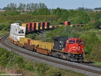 Amply powered by CN 2197, this short train 149 was crossed over to the south track at Clark, a few miles prior, in deference to their upcoming lift at Oshawa. 1730hrs.