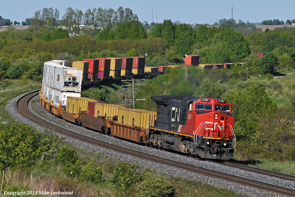 Amply powered by CN 2197, this short train 149 was crossed over to the south track at Clark, a few miles prior, in deference to their upcoming lift at Oshawa. 1730hrs.