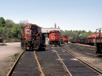 A mid-spring Sunday afternoon reveals a potpourri of all GMD power assembled at CN’s Hamilton waterfront Stuart Street Yard facility. Left to right are GP9 4536, GP40-2L (W) 9631, freshly rebuilt GMD1u 1411 and mostly out of frame GP9 4537. Origin and disposition of the assortment as follows:•	GMD1u 1411 – built by GMD in 1958 as GMD1 1009, rebuilt by Pointe St. Charles as GMD1u 1411 in 1989, retired in 2006.•	GP9 4536 – built by GMD in 1957, rebuilt by AMF (Atelier Montreal Facility) as GP9u (GP9RM) 7053 in 1992, retired in 2010.•	GP9 4537 – built by GMD in 1957, rebuilt by AMF (Atelier Montreal Facility) as GP9u (GP9RM) 7071 in 1992, still in service.•	GP40-2L (W) 9631 – built by GMD in 1975, retired and sold to Watco in 2004, renumbered to WAMX 4021.Recently announced Metrolinx plans call for the shop building to be razed in order to provide a new right of way related to expanded, all day GO Transit service.