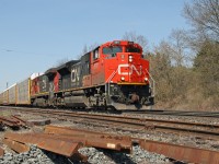 CN 148 has quite a lot of general merchandise on the head end this first day of May 2013 at Copetown, ON.  
About 1/3 of the way back, the double stacks, more indicative of Q-148, will reveal the train's identity.  

