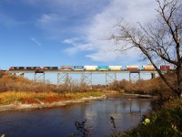 CN's Q111 crosses the Little Saskatchewan River just east of the town of Rivers.