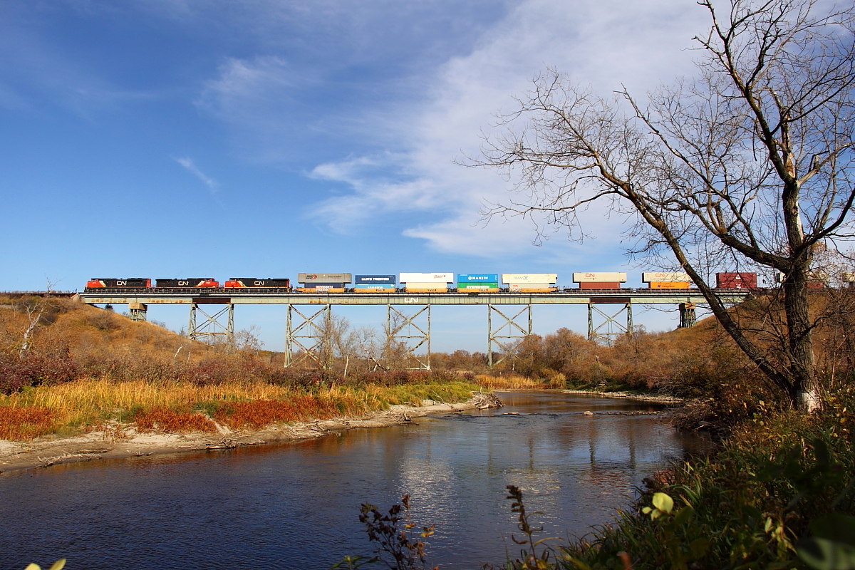 CN's Q111 crosses the Little Saskatchewan River just east of the town of Rivers.