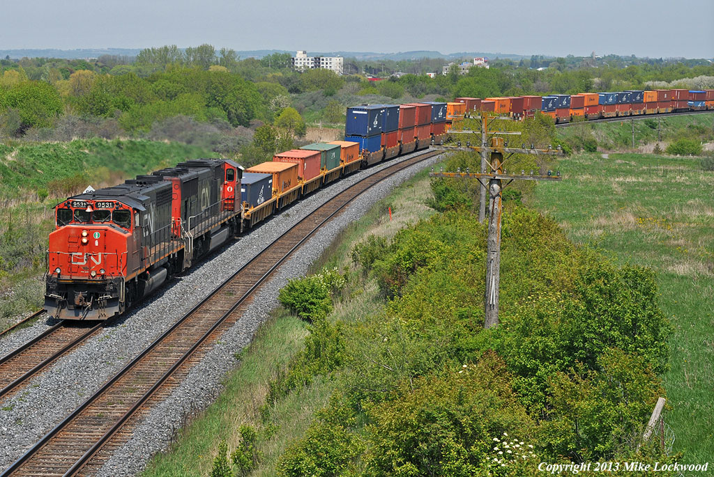"Don't call me old". A 38 year old CN 9531 leads a somewhat younger CN 5751 on train 149 at Bowmanville, Ontario. 1415hrs.