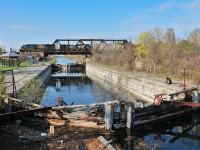 In the sunset, CN 326 is passing over the historical "Canal Soulange" under the regards of the local fisherman.