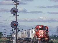 CP Rail GP38-2 3044 leads the #529 (Toronto - Detroit Roadrailer) through Hornby. #529 left Lambton around 1800 and went west with priority over pretty much everything. 