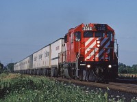 For quite awhile GP38-2 3046 was the regular power on the Toronto - Detroit Roadrailer trains. Here it is heading west, coming out of the Hornby Dip about to cross 5th Line. 