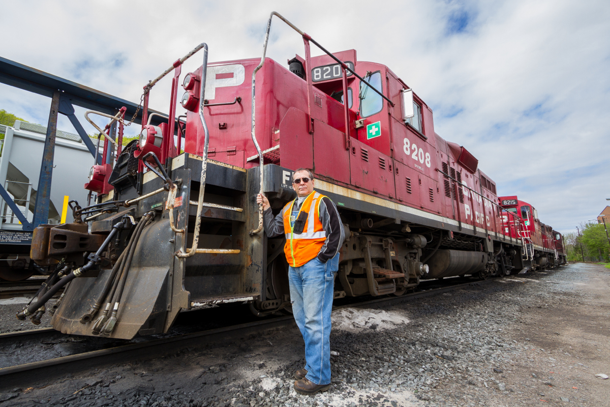 A long time engineer with Canadian Pacific and a good friend of mine, Andy Capp is seen posing infront of CP 8208 at Kinnear Yard in Hamilton, ON.