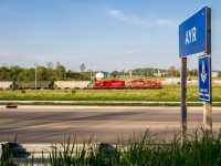 With a pair of GP9s for power, The Pender Job backs its train into a siding along the Ayr Industrial Spur on a gorgeous Victoria Day evening. About half an hour after I took this photo the train dropped its sole hopper car on the ground when proceeding back onto the Galt Sub at the wye.