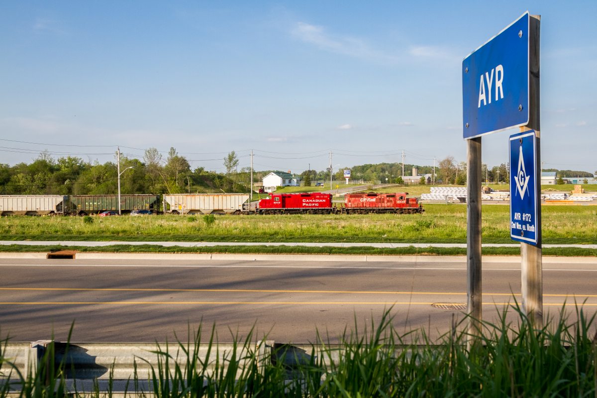 With a pair of GP9s for power, The Pender Job backs its train into a siding along the Ayr Industrial Spur on a gorgeous Victoria Day evening. About half an hour after I took this photo the train dropped its sole hopper car on the ground when proceeding back onto the Galt Sub at the wye.