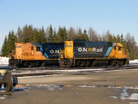 ONT 1601 and 1802 await their next assignments at the South end of Cocrhane shops during a sunny Sunday night. 