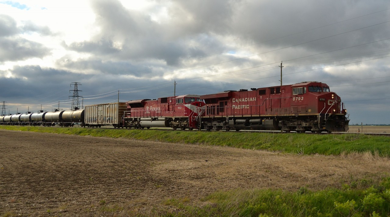 CP 609 led by CP 8793 & INDR 9013 heads westbound thru Haycroft with 100 crude oil empties. The INDR loco came across the border on an eastbound 242 about 8 hours prior and got shuffled onto this train in London.