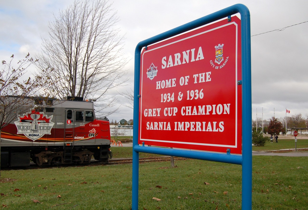 The VIA/CFL grey cup train made a special trip to downtown Sarnia in late 2012. Seen here on CN's downtown point edward spur certainly rare millage for VIA. VIA # 6445 is shown spotted beside newly placed park signage indicating the winning Sarnia Imperials Grey Cup Champions.