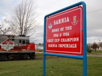The VIA/CFL grey cup train made a special trip to downtown Sarnia in late 2012. Seen here on CN's downtown point edward spur certainly rare millage for VIA. VIA # 6445 is shown spotted beside newly placed park signage indicating the winning Sarnia Imperials Grey Cup Champions. 