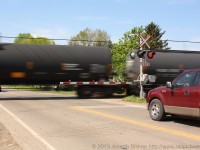 <br>Waiting on a train… <br>Trains move millions of tons of merchandise nationwide daily.  Have you ever stopped to think about what is going by in that boxcar on that freight train?  Or in this case what is in that tankcar.  <br>Maybe the fuel in those tank cars may be what is pumped into that trucks tank the next time it is filled..