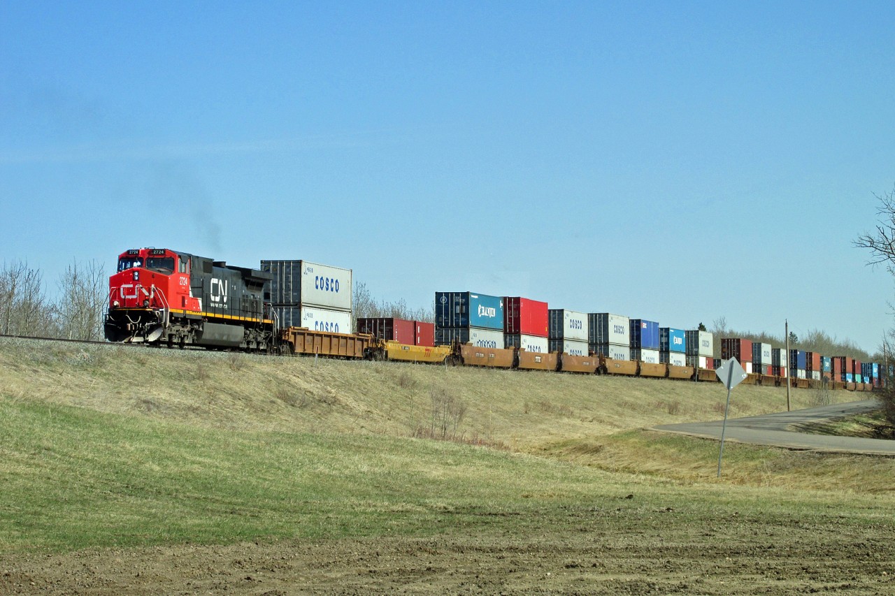 DASH 9-44CW, CN 2724 is the rear "pusher" as this intermodal heads east up the hill from Ardrossan.