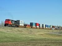 DASH 9-44CW, CN 2724 is the rear "pusher" as this intermodal heads east up the hill from Ardrossan.