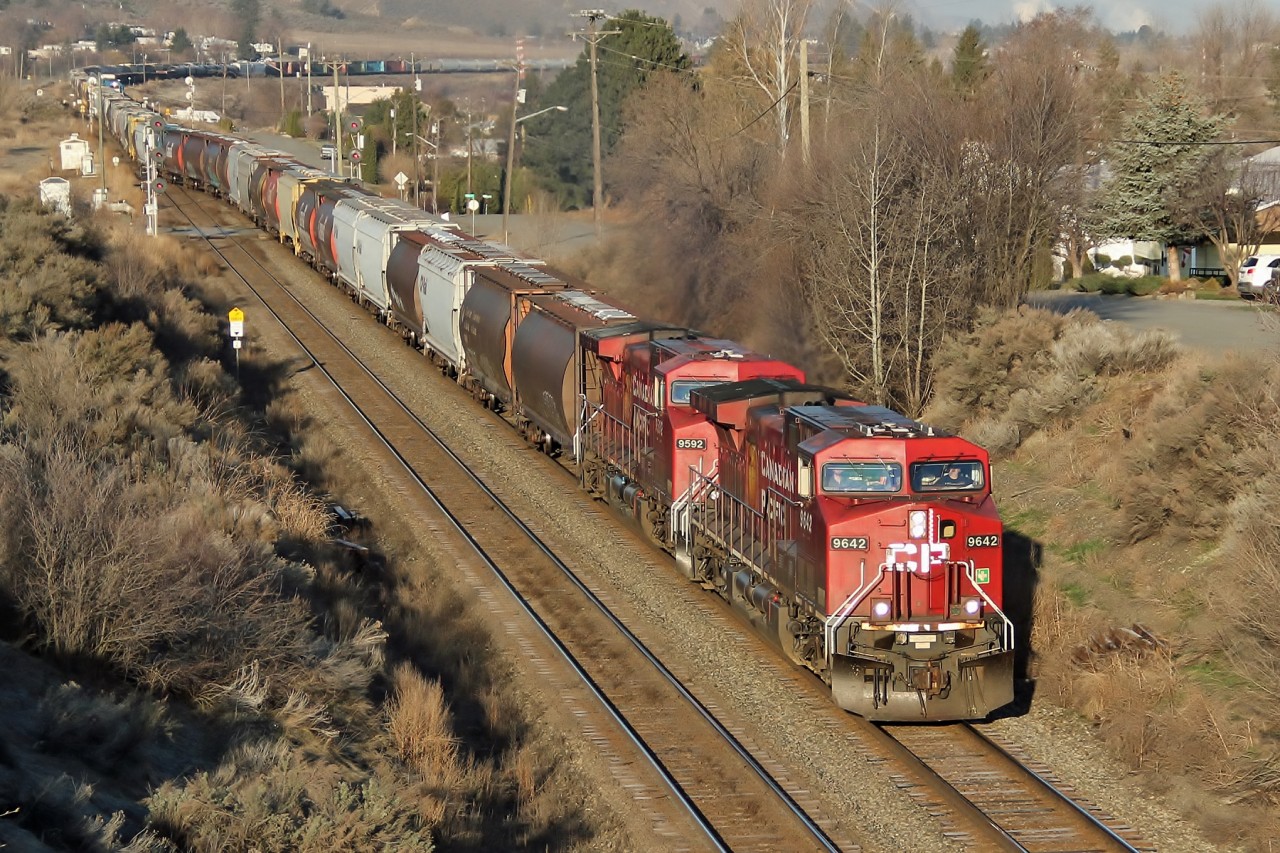 AC4400CWs 9642 and 9592 cross over from the south to the north main as they lead an empty grain train eastbound from Kamloops.