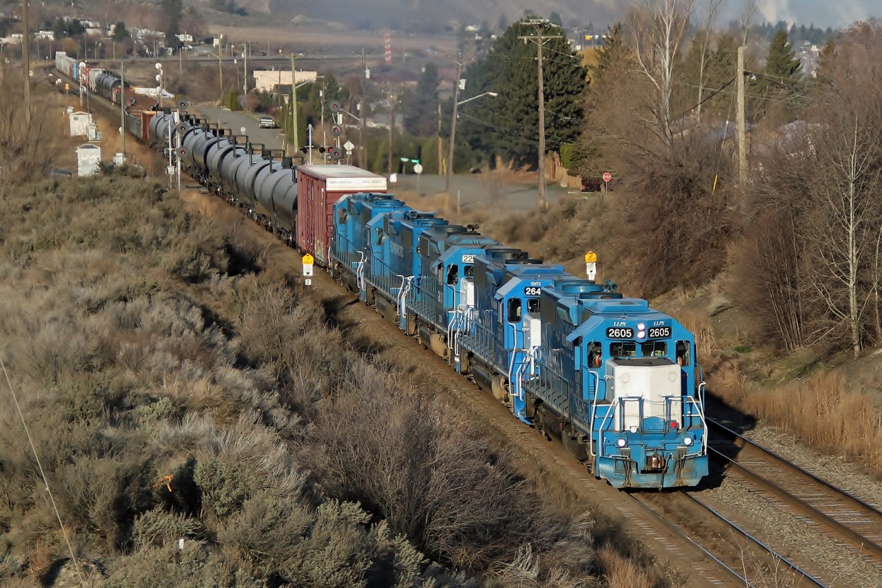Kelowna Pacific Railway’s leased GP38-2s LLPX 2605, GMTX 2641, GMTX 2258, GMTX 2632 and LLPX 2606 head east on CP Rail's Shuswap Sub.