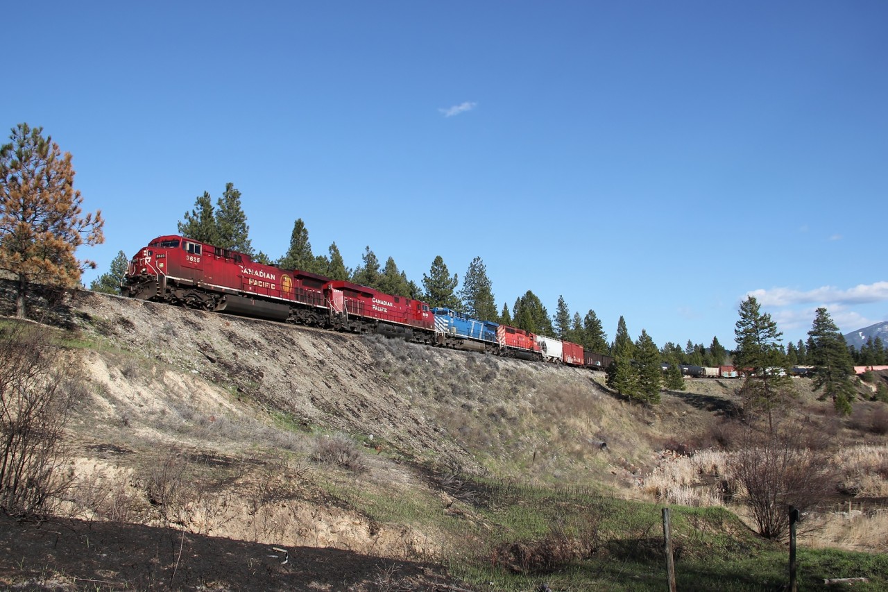 CP AC4400CW 9625, CP ES44AC 8855, CEFX AC4400CW 1007 and CP SD40-2 6030 lead a eastbound freight from Cranbrook.