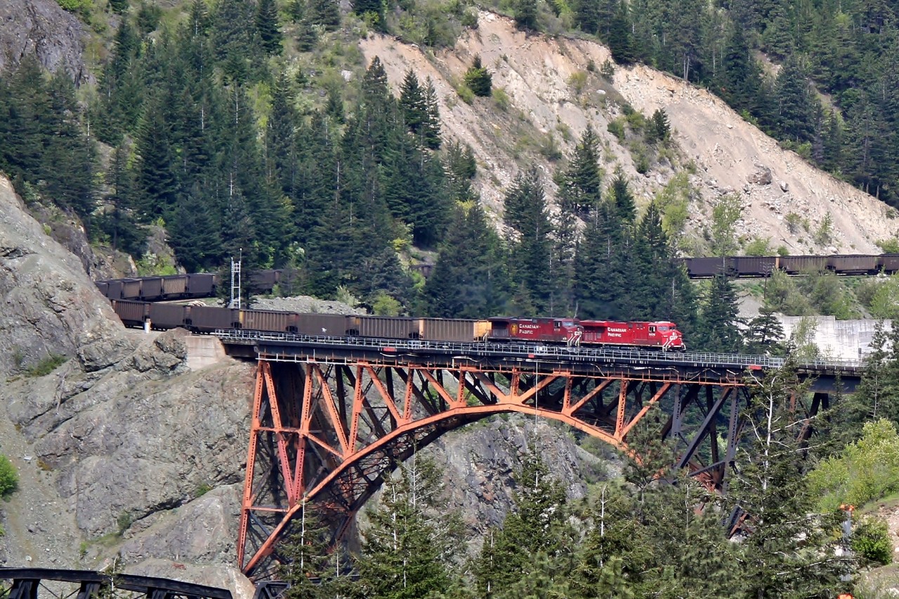 CP 8824 and 8879 lead a westbound coal train over CP Rail's Thompson Sub and the Fraser River at Cisco, BC.
