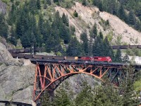 CP 8824 and 8879 lead a westbound coal train over CP Rail's Thompson Sub and the Fraser River at Cisco, BC.