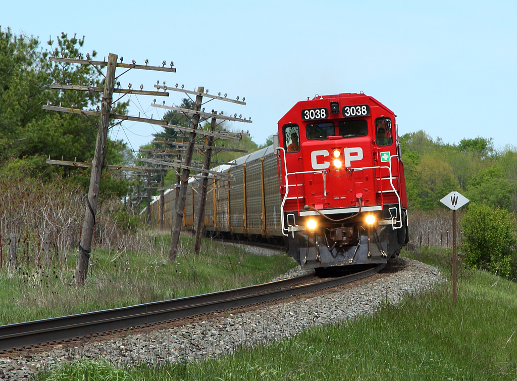 The Wolverton Job is at the Ayr mileboard with three GP38-2s leading a string of multi's. The old code lines poles still exist on much of the OCS part of the Galt Sub, giving this stretch of track some character.