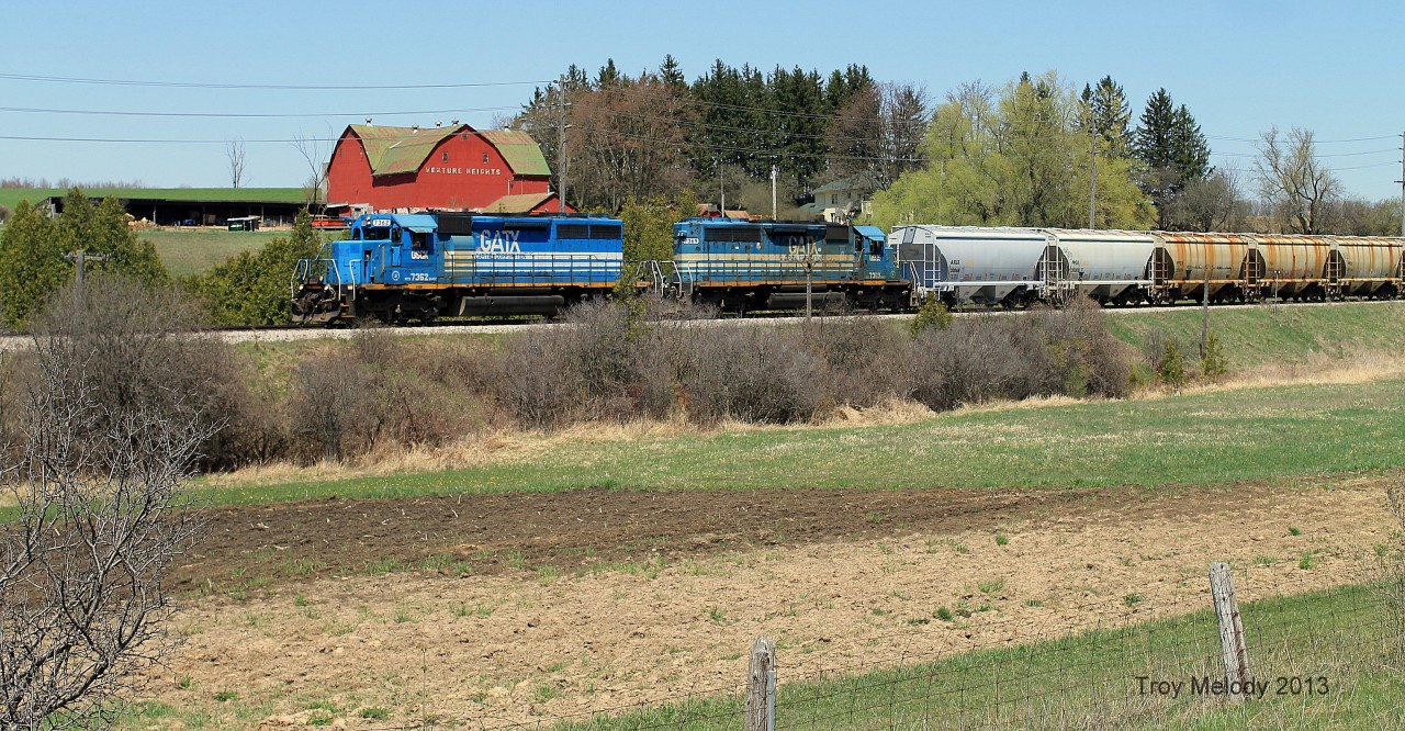 A Goderich Exeter mixed freight passes Venture Heights farms just outside the Guelph city limits. I'm glad I finally managed to get this photo off my bucket list. I was given a friendly greeting from the crew as they noticed me on the side of Hwy 7.