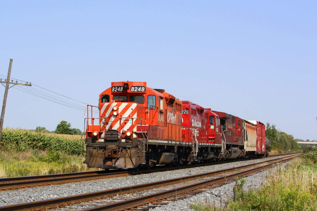 The Cobourg Turn hauls a broken GE and a few cars passed Darlington siding.