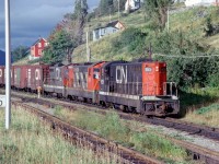   The sun breaks through just in time as London built CN 925 leads a 3 unit consist into the yard at Cornerbrook Newfoundland. The Railroad in Newfoundland nothing but a memory now. 