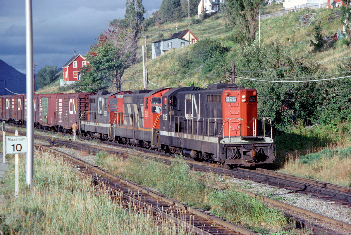 The sun breaks through just in time as London built CN 925 leads a 3 unit consist into the yard at Cornerbrook Newfoundland. The Railroad in Newfoundland nothing but a memory now.