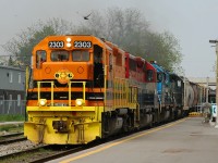 431 hussels through the Kitchener GO/VIA station with QGRY 2303, RLK 4095, GSCX 7362, and GSCX 7369