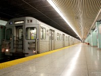 TTC 5165 leads a set of T1 subway cars, southbound at York Mills Station on the northern section of the Yonge line.