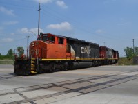 CN 439 rounds the Bend at Walker Rd in Windsor, and coming off of the CN Pelton Spur and going down the CN Caso Spur at mp 219.21. There is a set of old gondolas sitting on the former CASO Mainline waiting to be loaded with Ties that were all ripped up from the removal company of the now Abandoned portion. (here is hoping that CN or CP uses this portion of the mainline to get to some of the Factories and adds some rail to these industries in the Future.)