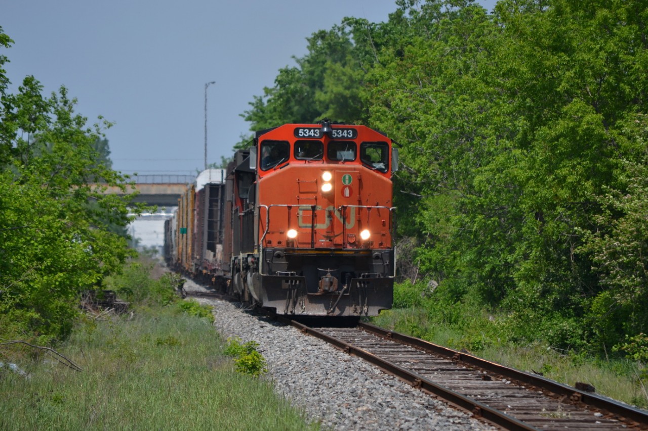 CN 439 just pulled off the CP Windsor Sub, and heading down the CN Pelton Spur. The Train is rocking back and forth over some old Switches that are sinking a little. The crew is getting bounced around a little, but also know not to blow the horn full blast as we are in City limits and people complain.