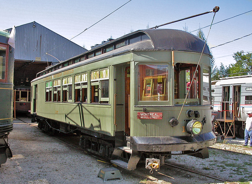 Montreal & Southern Counties interurban car #107 stands outside the car barn at the Halton County Radial Railway in Milton, ON. For more pics & video from my collection see northamericabyrail.info