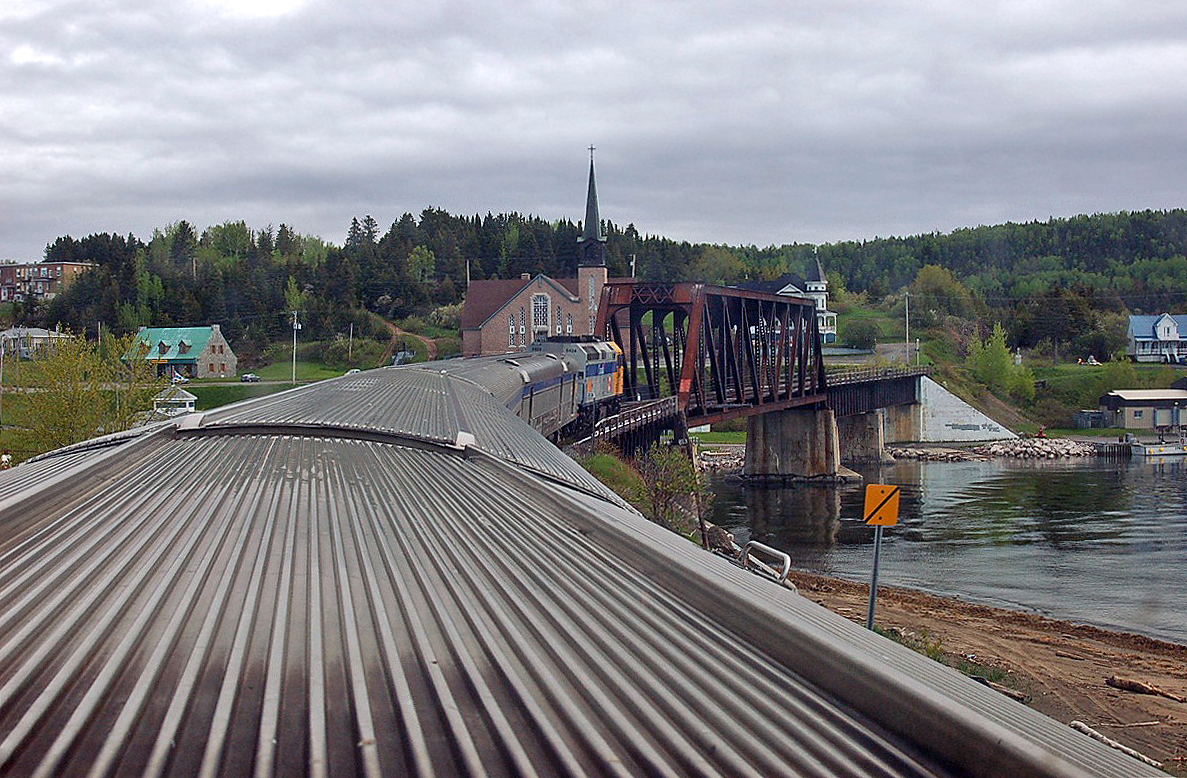 In the 'Skyline' car on the eastbound "Chaleur", approaching a trestle at Port Daniel, Quebec. For more pics & video from my collection see northamericabyrail.info